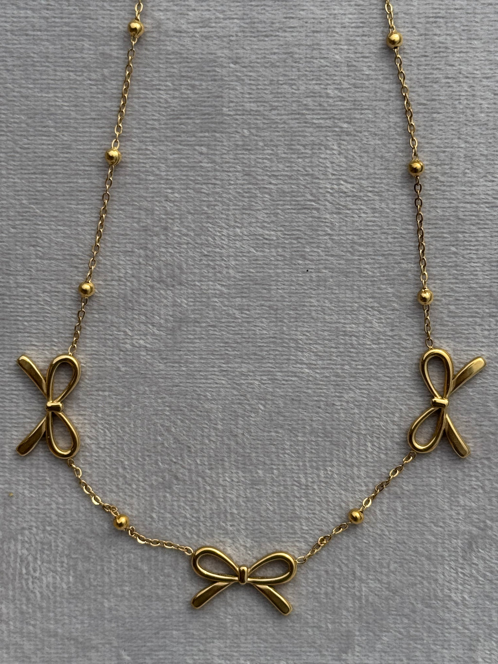 Triple-bow pendant