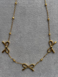 Triple-bow pendant
