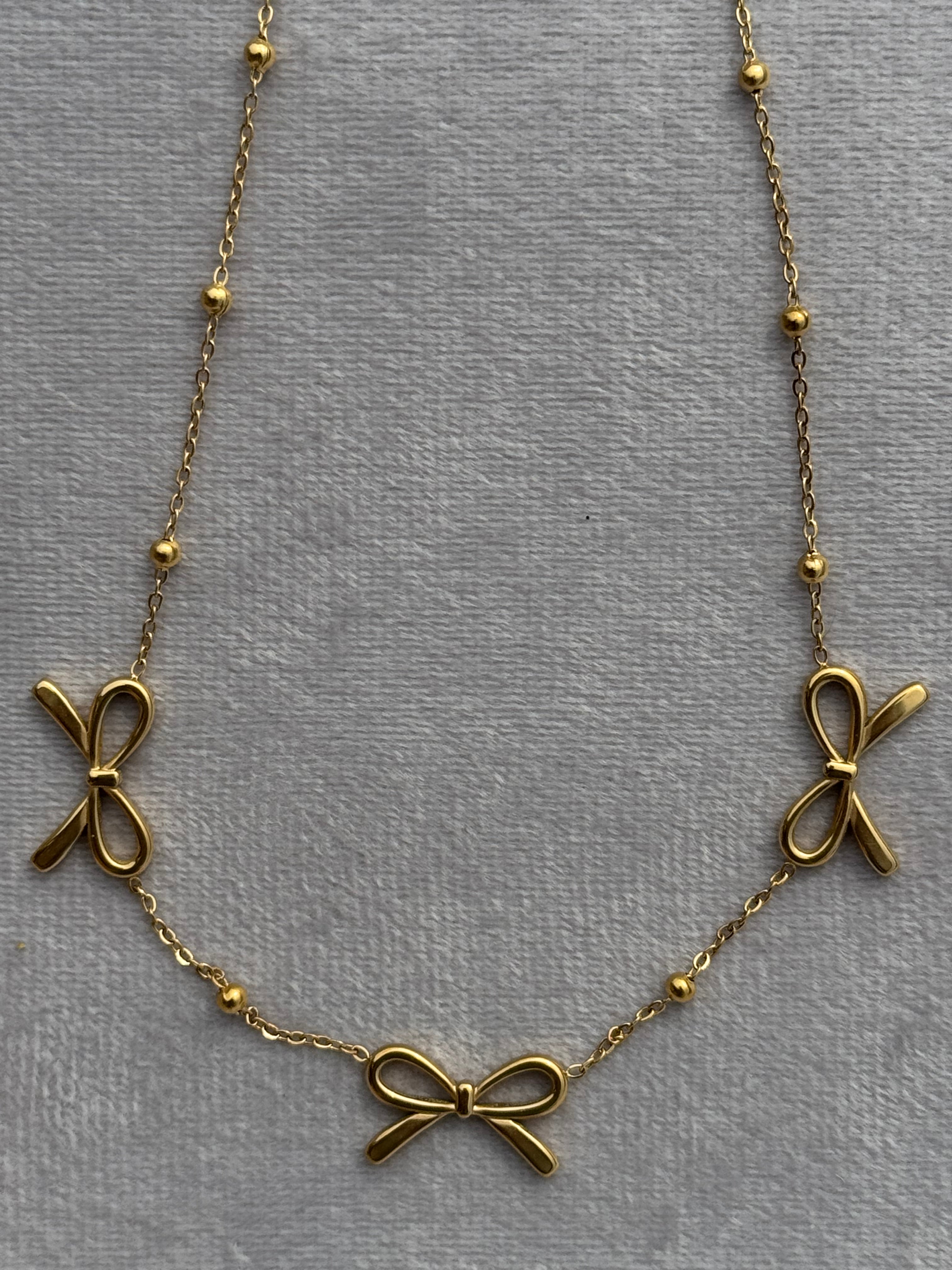 Triple-bow pendant