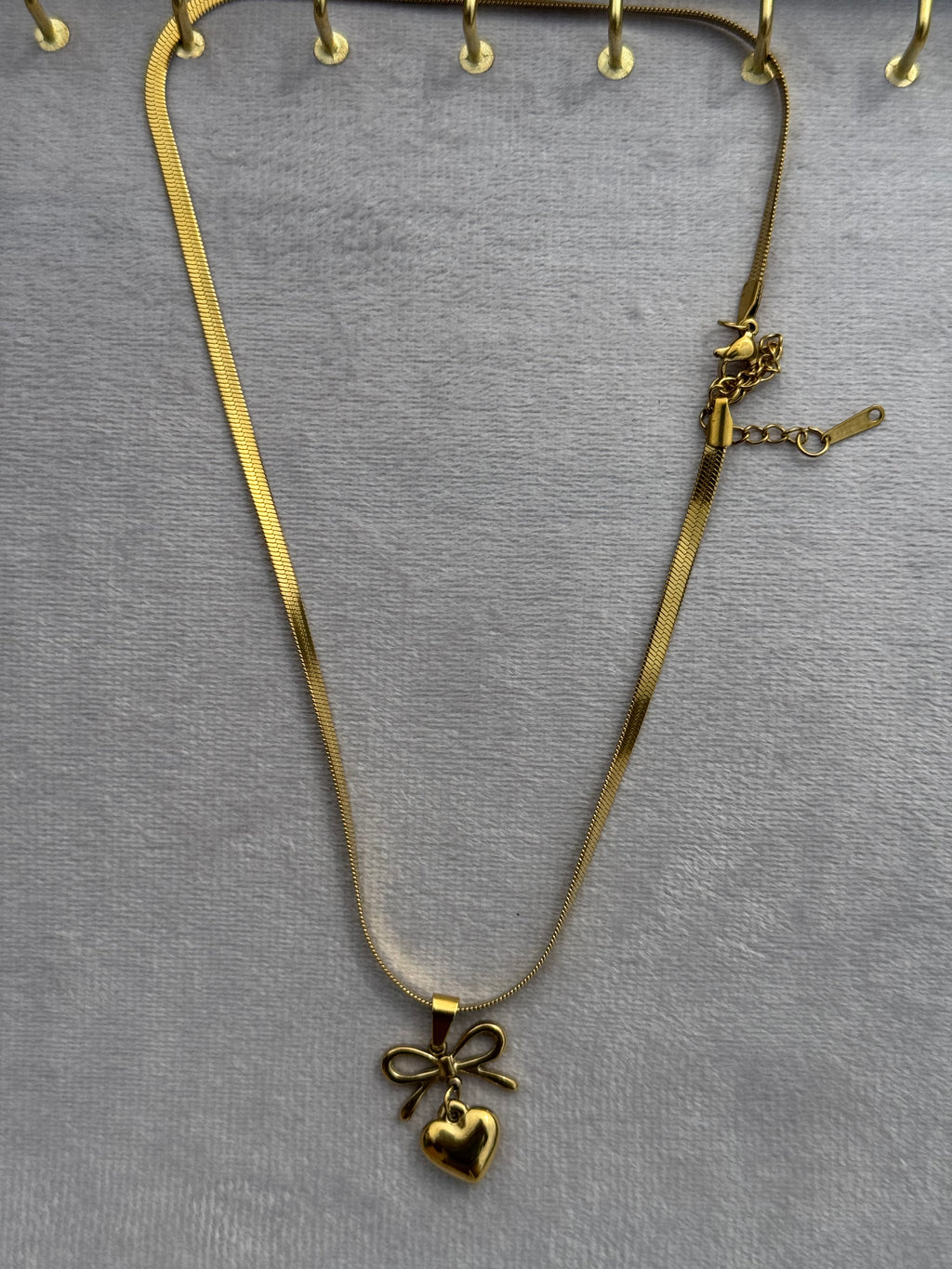 Bow-heart pendant