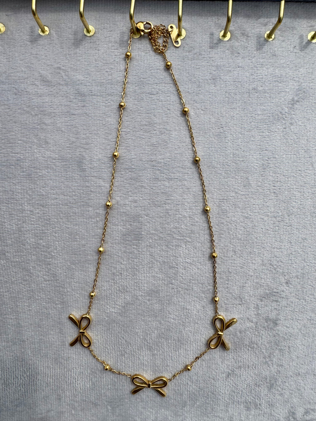 Triple-bow pendant