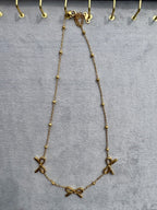Triple-bow pendant
