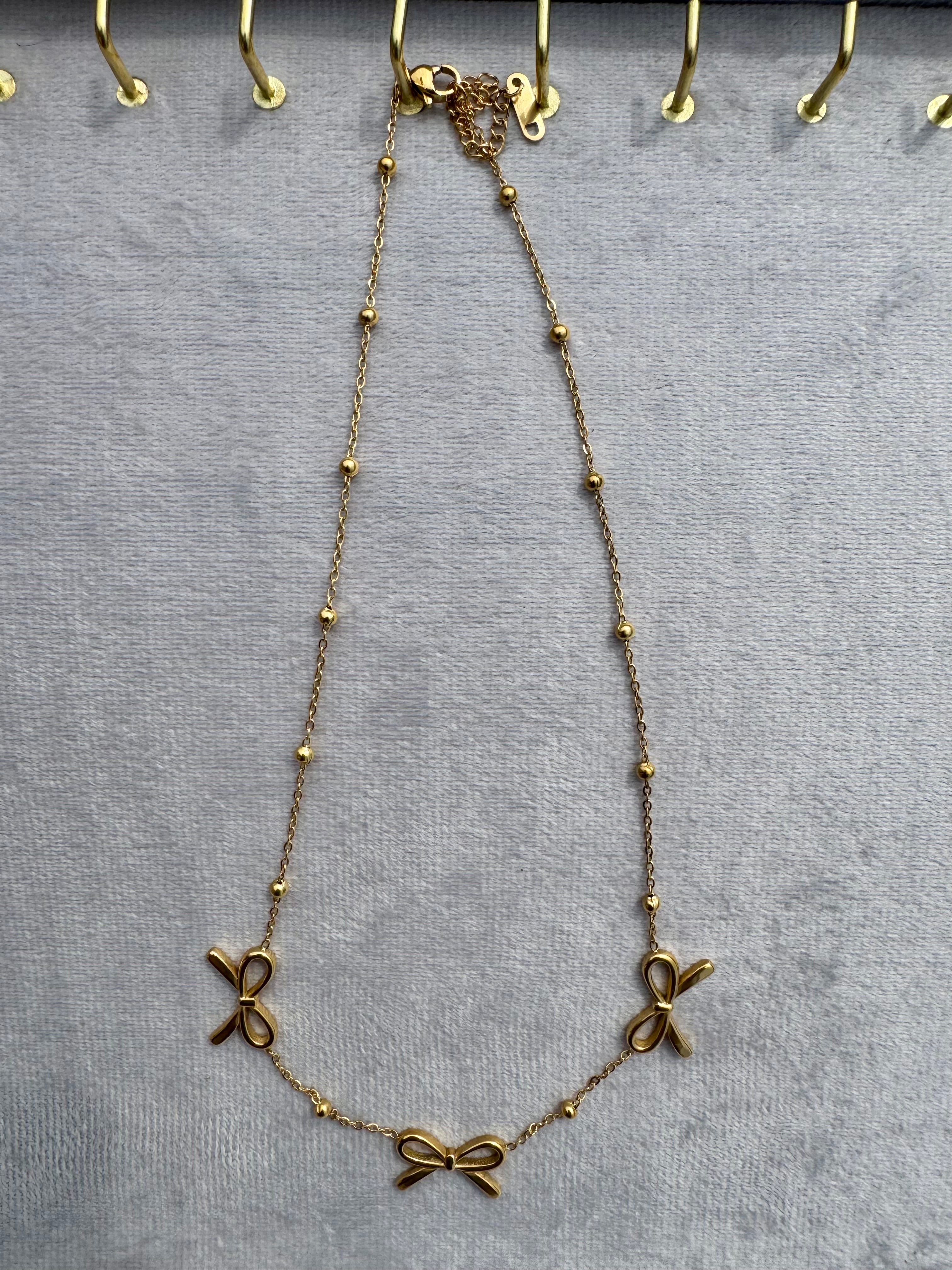 Triple-bow pendant